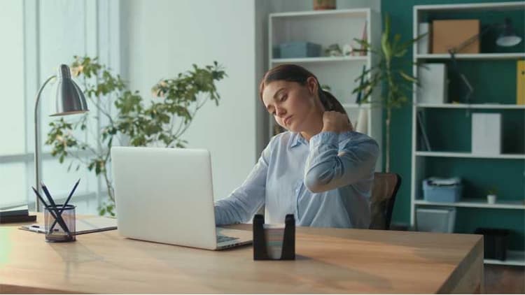 10 Desk Exercises To Fix Stiff Necks, Sore Backs, And Tight Hips